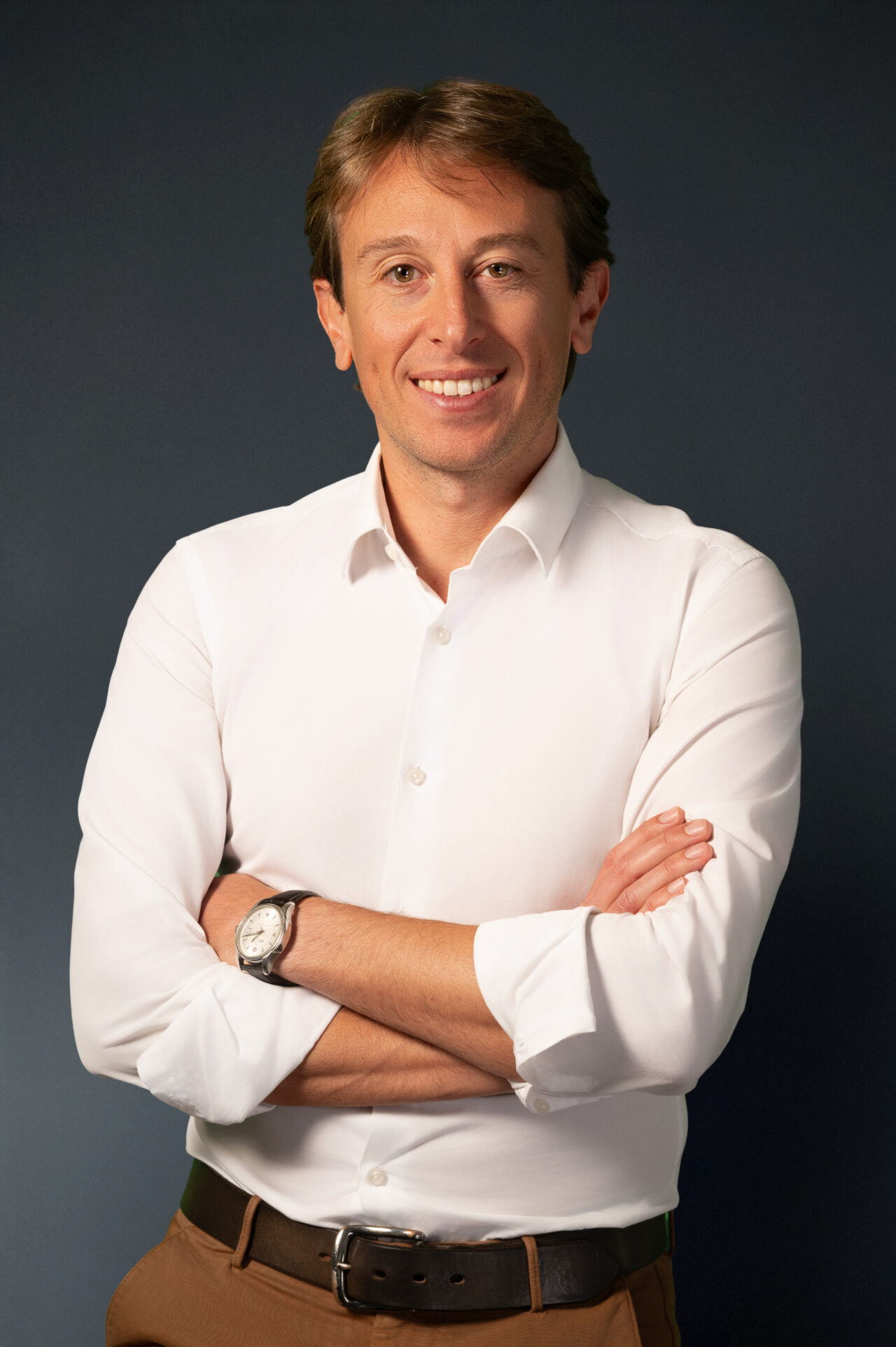 Casual corporate team headshots of 30-something caucasian executive.