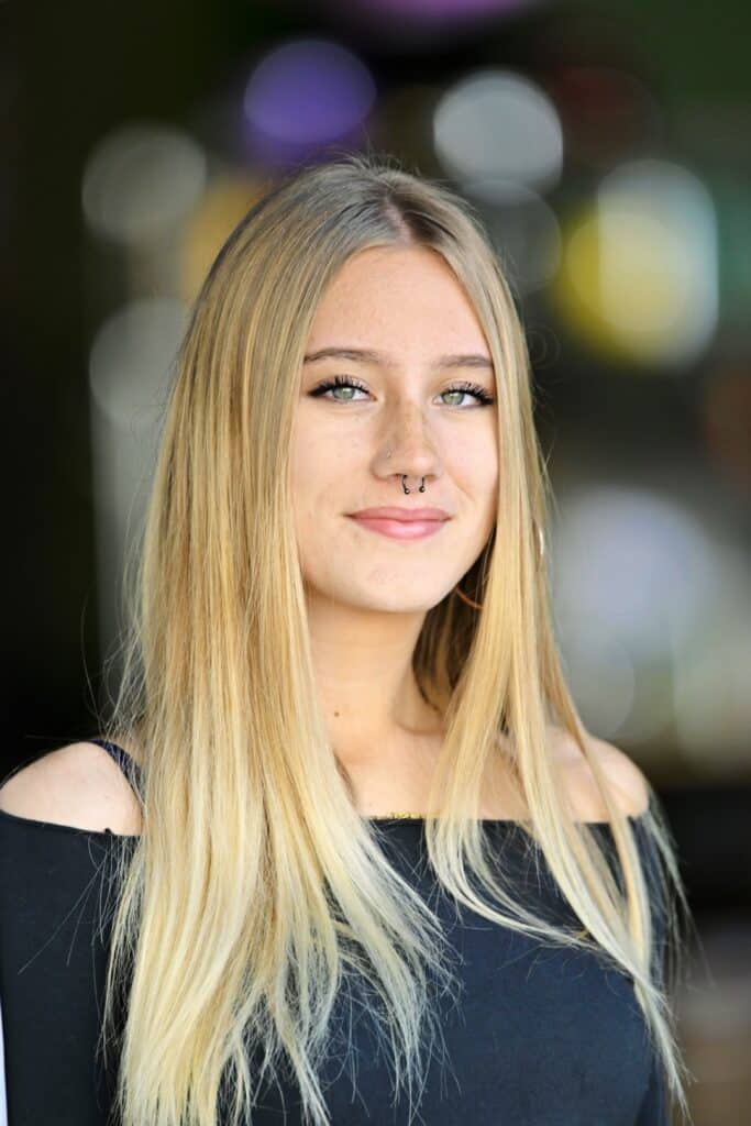 photo of blonde teen in front of a blurred background - la headshot photographer