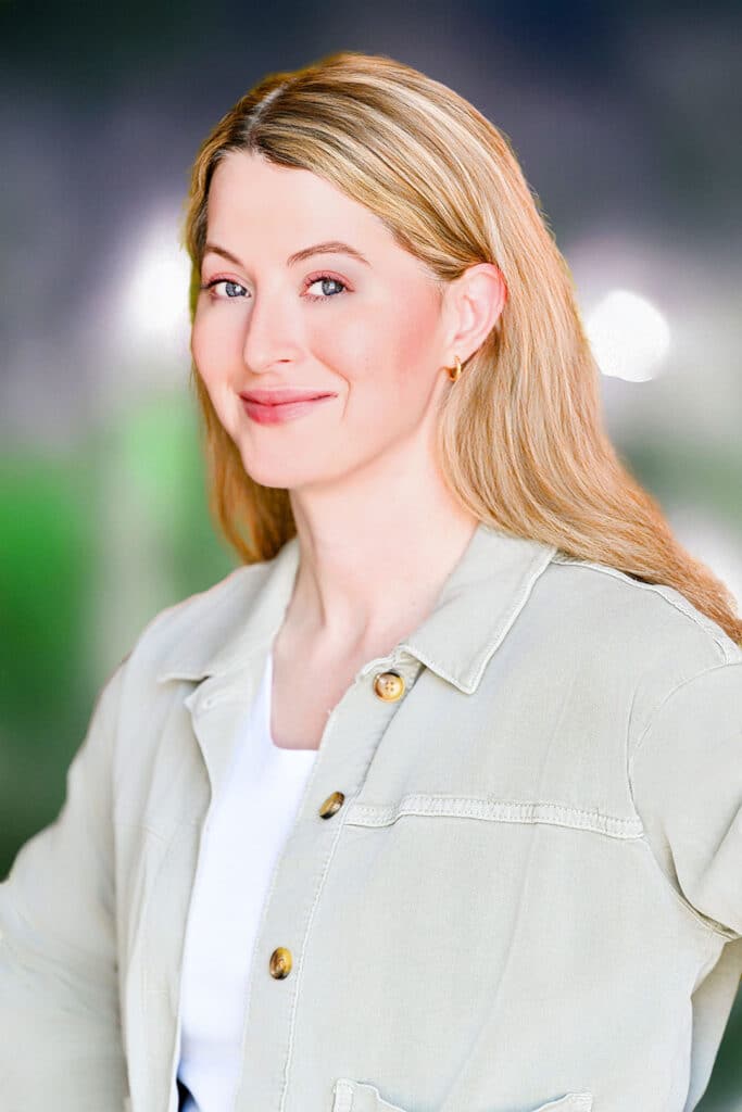 Headshot of woman overcoming stiffness and nerves during a headshot session.